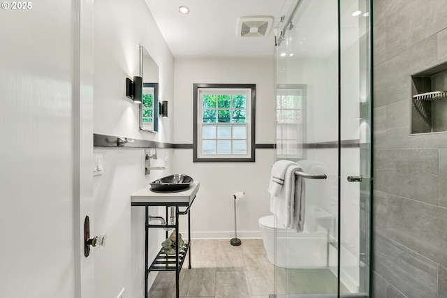 912 Van Buren St, Eugene, OR 97402 - full bathroom featuring a shower stall, toilet, a sink, and baseboards
