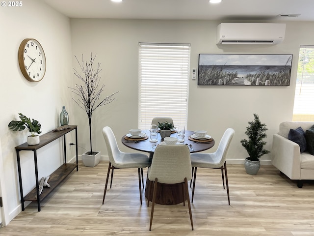 2660 Evergreen Ct, Salem, OR 97301 - dining area with an AC wall unit, recessed lighting, light wood-type flooring, and baseboards