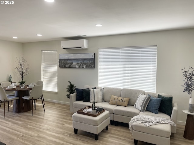 2660 Evergreen Ct, Salem, OR 97301 - living room with a wall unit AC, light wood-type flooring, recessed lighting, and baseboards