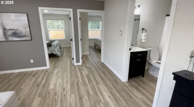 2660 Evergreen Ct, Salem, OR 97301 - ensuite bathroom with toilet, wood finished floors, vanity, and baseboards