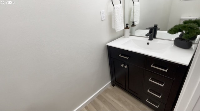 2660 Evergreen Ct, Salem, OR 97301 - bathroom with vanity, wood finished floors, and baseboards