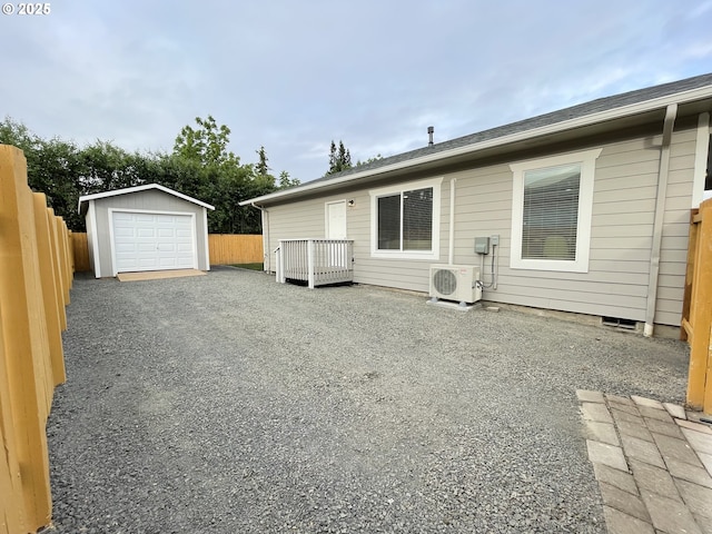 2660 Evergreen Ct, Salem, OR 97301 - rear view of house with ac unit, a garage, an outbuilding, and driveway