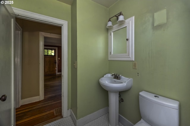 3955 SE Kelly St, Portland, OR 97202 - half bathroom featuring toilet and tile patterned floors