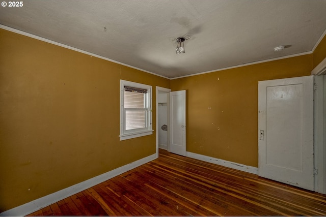 3955 SE Kelly St, Portland, OR 97202 - empty room with crown molding, a smoke detector, and wood-type flooring