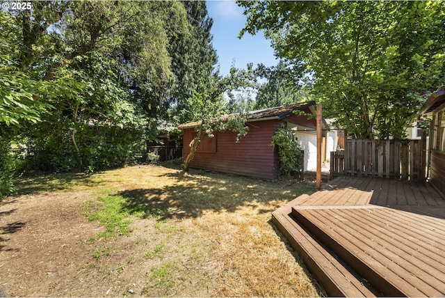 3955 SE Kelly St, Portland, OR 97202 - fenced backyard featuring a deck and an outbuilding
