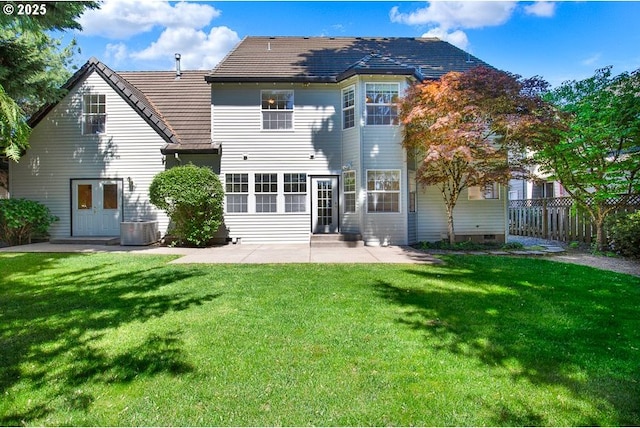 rear view of house featuring a patio and central AC unit