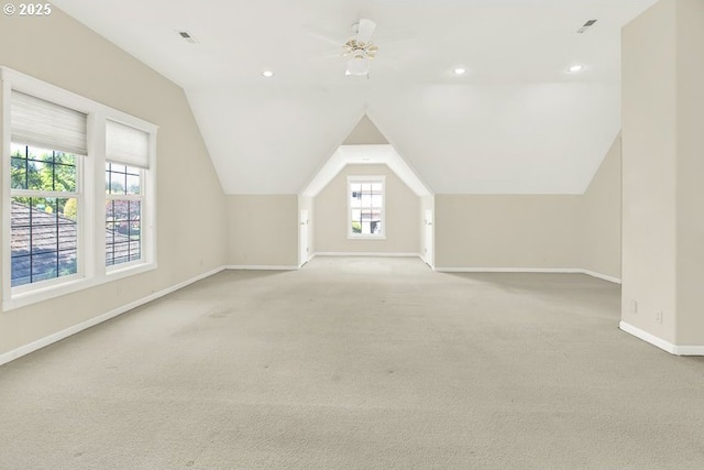 bonus room featuring baseboards, light colored carpet, lofted ceiling, recessed lighting, and a ceiling fan