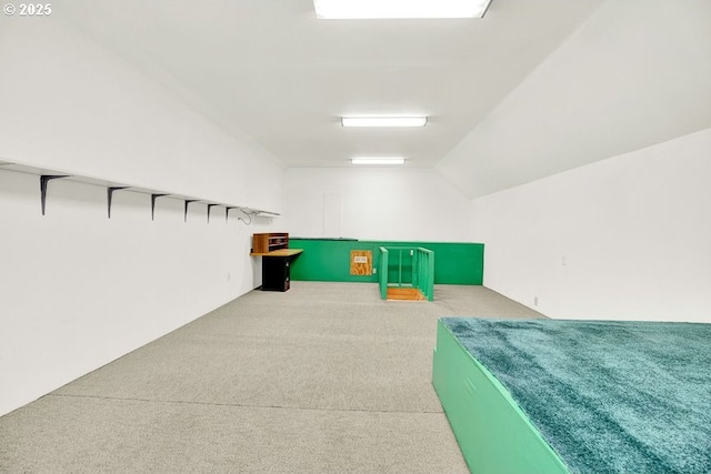 rec room with carpet and lofted ceiling