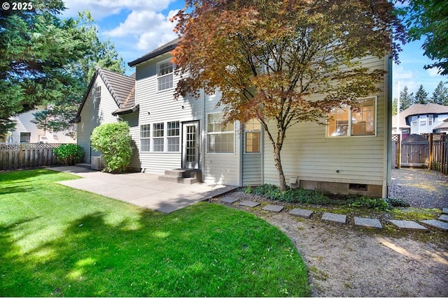 rear view of property featuring a patio and crawl space