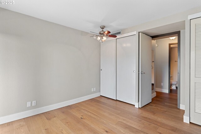 unfurnished bedroom with ceiling fan and light hardwood / wood-style floors