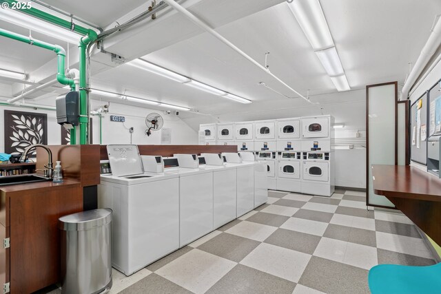 laundry room with sink, washer and clothes dryer, and stacked washing maching and dryer