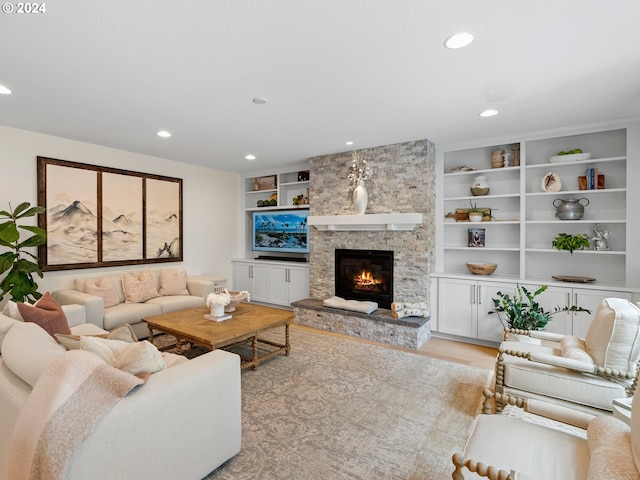 9010 SW Inez St, Tigard, OR 97224 - living room with a fireplace, light wood finished floors, and recessed lighting