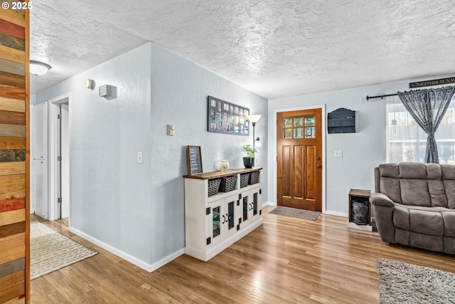 living room with hardwood / wood-style flooring and a textured ceiling