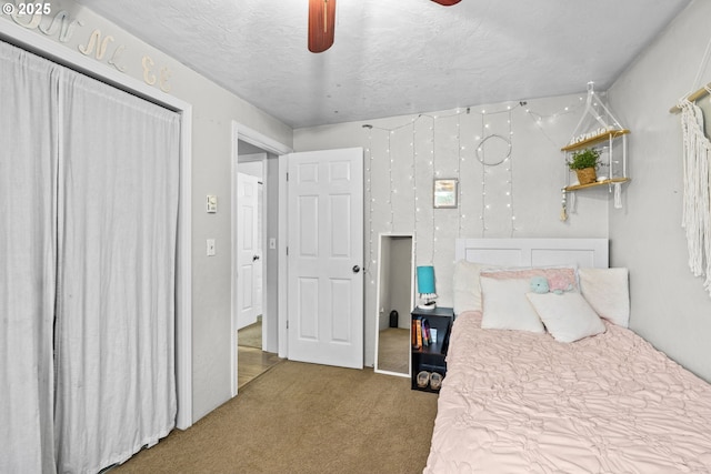 carpeted bedroom featuring a textured ceiling