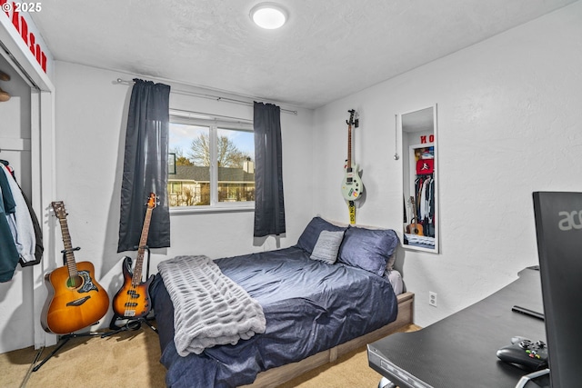 carpeted bedroom with a textured ceiling