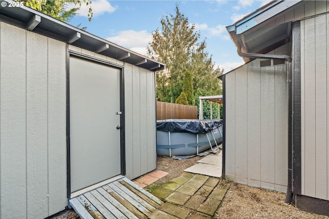 view of outbuilding with a covered pool