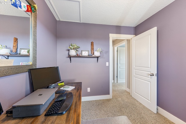 office space featuring carpet floors and a textured ceiling