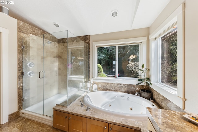 bathroom featuring independent shower and bath