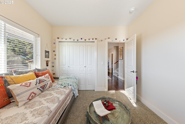 carpeted bedroom featuring a closet