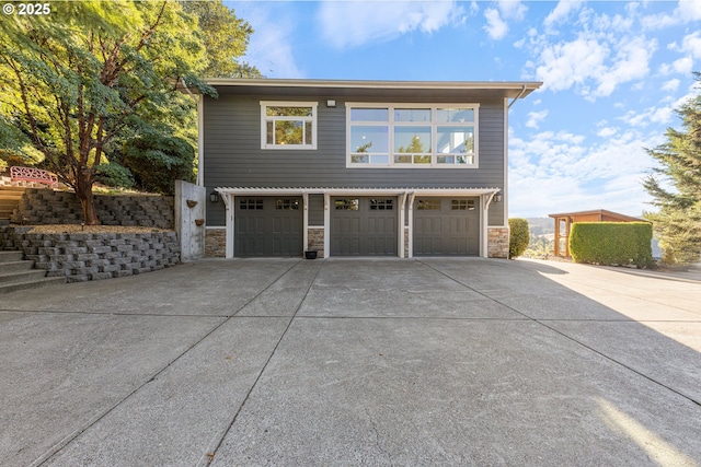 view of side of property with a garage