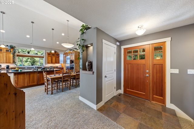 foyer with a textured ceiling