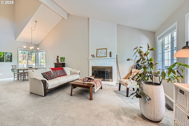 carpeted living area featuring a chandelier, a brick fireplace, baseboards, high vaulted ceiling, and beamed ceiling
