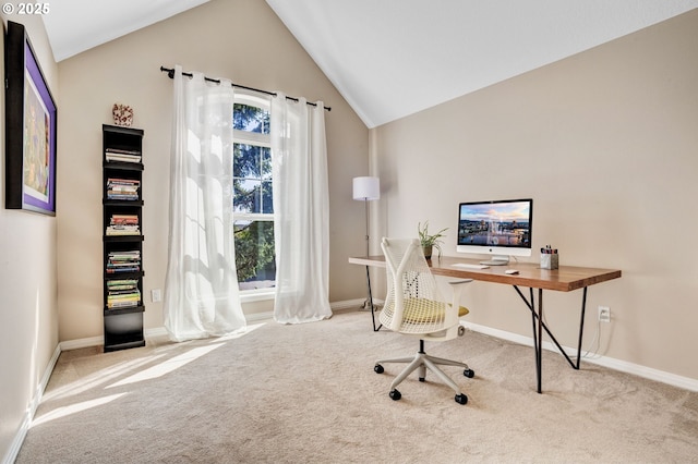 home office featuring carpet, lofted ceiling, and baseboards