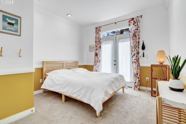carpeted bedroom featuring baseboards, access to outside, and ornamental molding