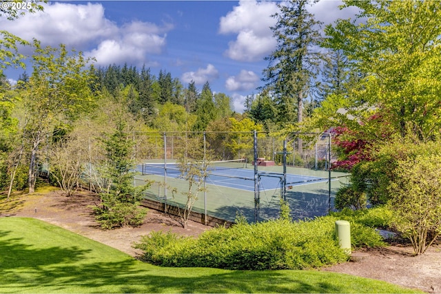 view of tennis court with fence