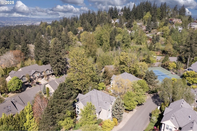 aerial perspective of suburban area featuring a forest