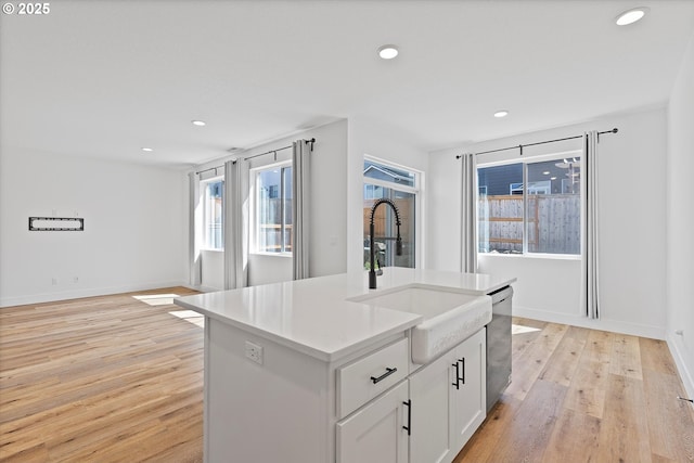 830 NE Buckthorn Dr, Estacada, OR 97023 - kitchen with a sink, dishwasher, light wood finished floors, recessed lighting, and a center island with sink