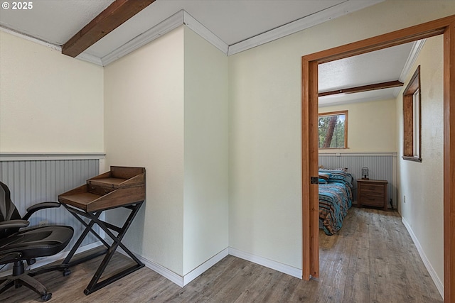 office area with wood finished floors and crown molding