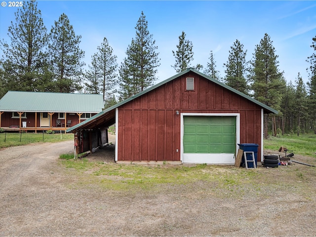 garage with driveway and a garage