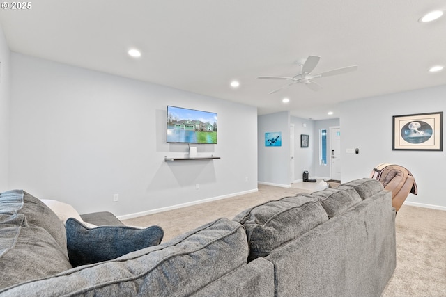 living area featuring light carpet, baseboards, recessed lighting, and a ceiling fan