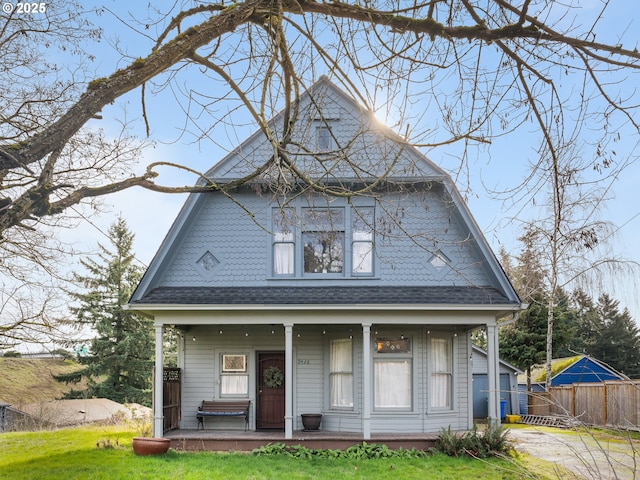 view of front of home with a front lawn and a porch