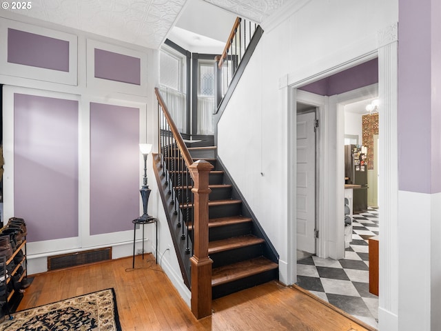 stairway featuring hardwood / wood-style floors