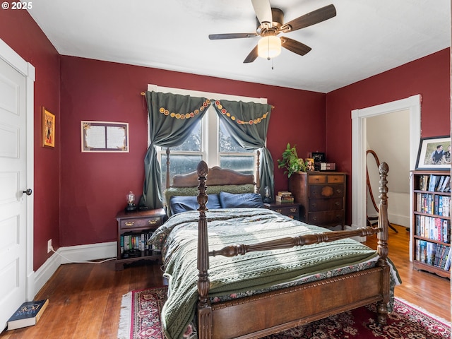 bedroom featuring ceiling fan and wood-type flooring