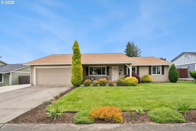 ranch-style house with a garage, concrete driveway, a front yard, and a shingled roof