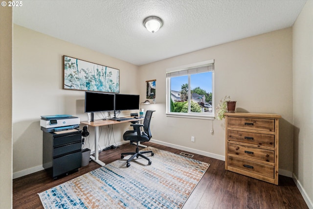 home office with wood finished floors, baseboards, and a textured ceiling