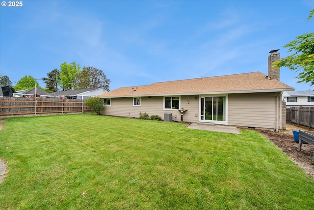 rear view of house with a chimney, a patio area, and central air condition unit