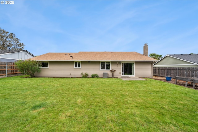 rear view of house with a patio area, a chimney, and central air condition unit