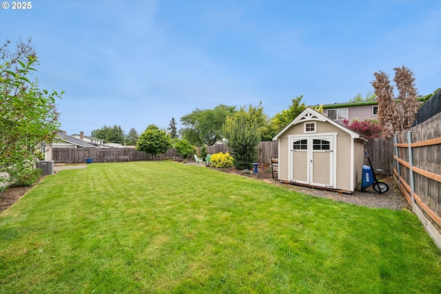 view of yard featuring a storage unit, an outdoor structure, and cooling unit