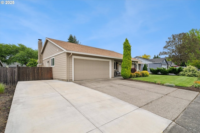 single story home featuring a garage, a chimney, and driveway