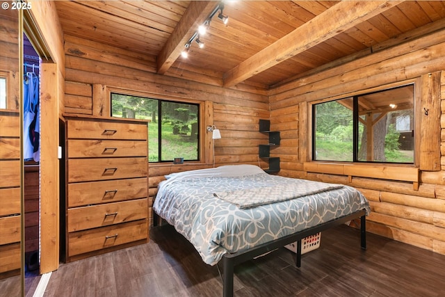 67388 Timberline Rd, Summerville, OR 97876 - bedroom featuring track lighting, wood ceiling, beamed ceiling, hardwood / wood-style flooring, and rustic walls