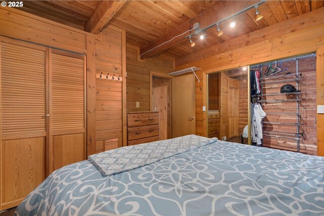 67388 Timberline Rd, Summerville, OR 97876 - bedroom featuring track lighting, wood walls, wooden ceiling, beam ceiling, and a closet