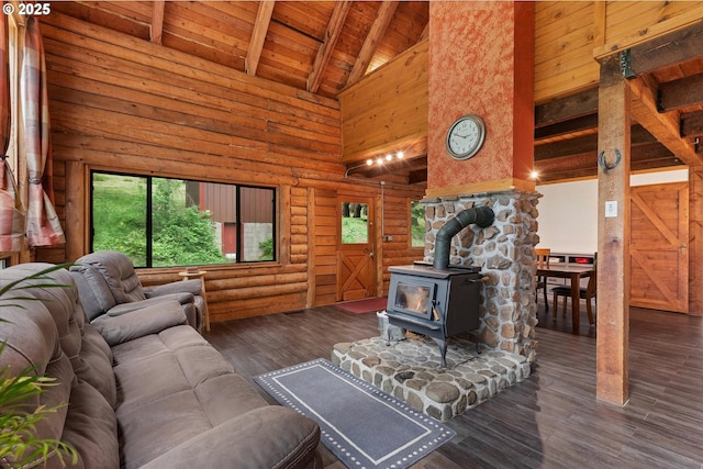 67388 Timberline Rd, Summerville, OR 97876 - living room featuring high vaulted ceiling, wood ceiling, a wood stove, beam ceiling, and wood finished floors