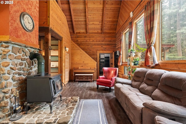 67388 Timberline Rd, Summerville, OR 97876 - living room featuring dark wood-style flooring, a wood stove, wood ceiling, wooden walls, and beam ceiling