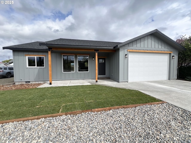 view of front facade featuring a garage, board and batten siding, concrete driveway, and a front yard