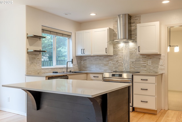 3166 NE Glencoe Oaks Pl, Hillsboro, OR 97124 - kitchen with wall chimney range hood, open shelves, light wood-type flooring, light countertops, and recessed lighting