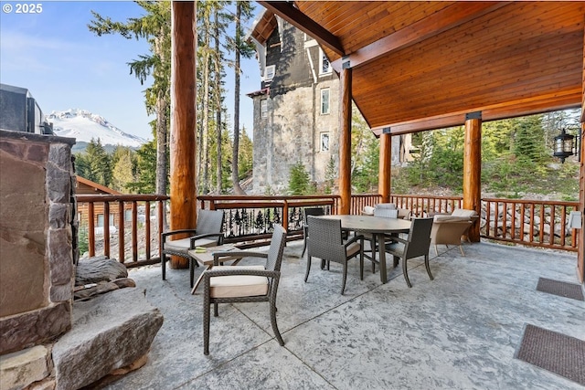 sunroom with a mountain view and healthy amount of natural light
